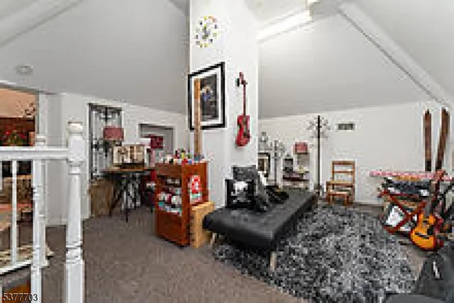 a living room with lots of furniture and a flat screen tv