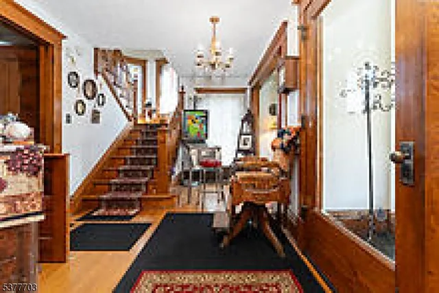 a view of a livingroom with furniture and stairs