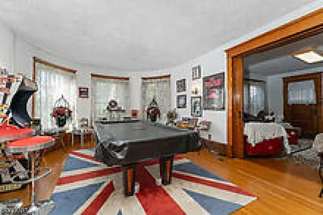 a view of a livingroom with furniture and toys
