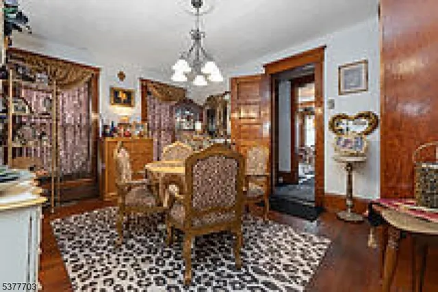 a view of a livingroom with furniture and chandelier