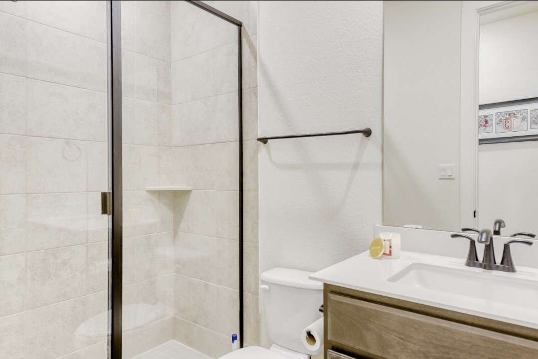 154 Kimble Creek Loop Kyle, TX 78640 - Photo 13 of 20 Full bathroom featuring vanity and a stall shower