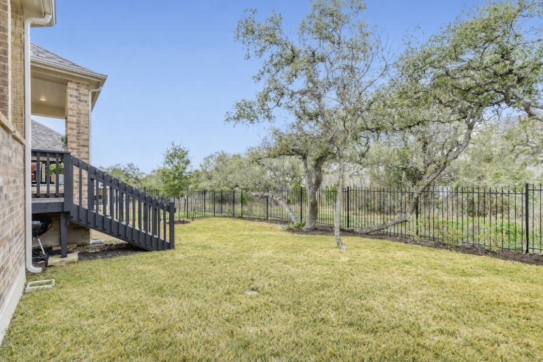 154 Kimble Creek Loop Kyle, TX 78640 - Photo 19 of 20 Fenced backyard featuring stairs