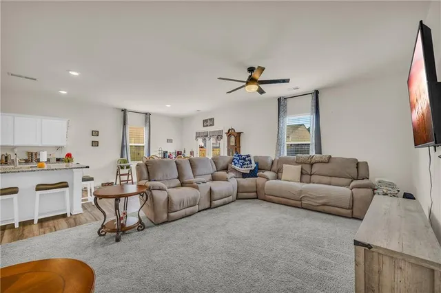 a view of a livingroom with furniture and tub