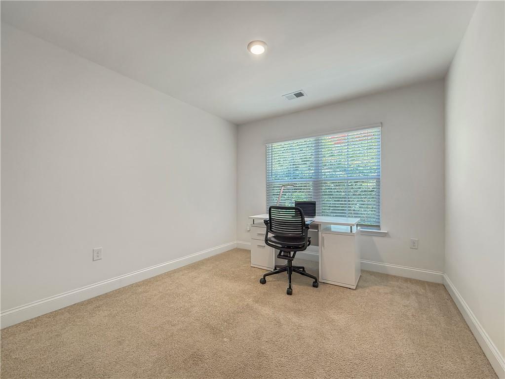 1160 Kendron Lane, Unit 16 Atlanta, GA 30329 - Photo 27 of 39 an empty room with a window