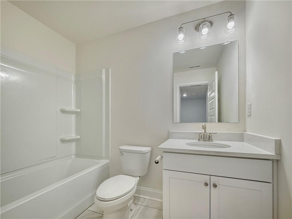 1160 Kendron Lane, Unit 16 Atlanta, GA 30329 - Photo 30 of 39 a bathroom with a sink a toilet and shower