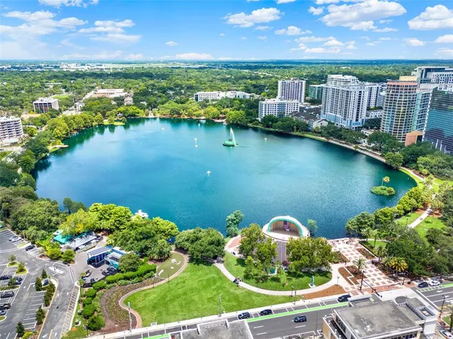 an aerial view of a house with a lake view