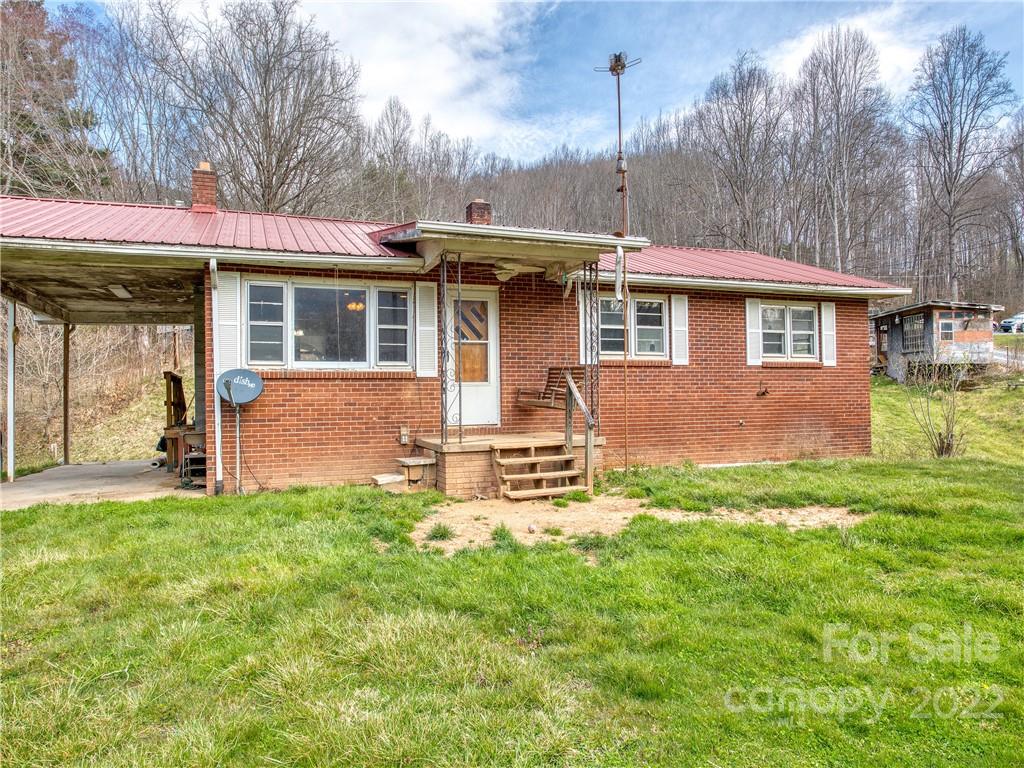 208 Balsam Ridge Road Waynesville, NC 28786 - Photo 1 of 25 a front view of a house with a yard