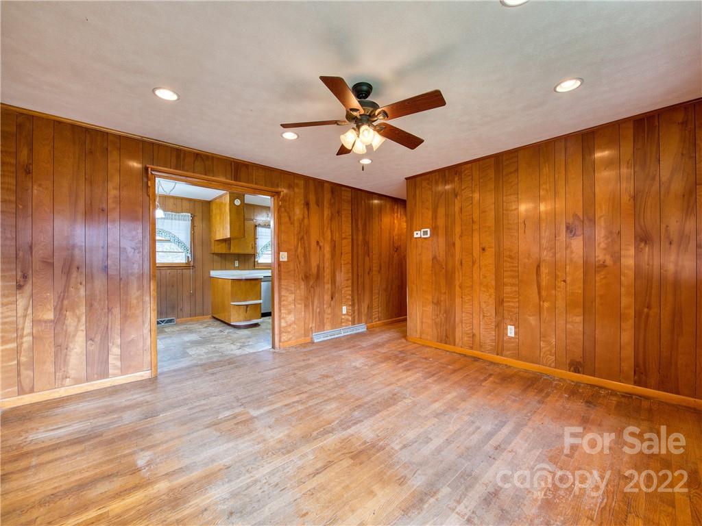 208 Balsam Ridge Road Waynesville, NC 28786 - Photo 15 of 25 a view of an empty room with a window and a ceiling fan