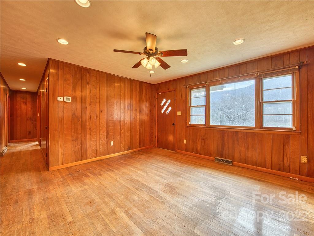 208 Balsam Ridge Road Waynesville, NC 28786 - Photo 16 of 25 a view of an empty room with a window and a ceiling fan