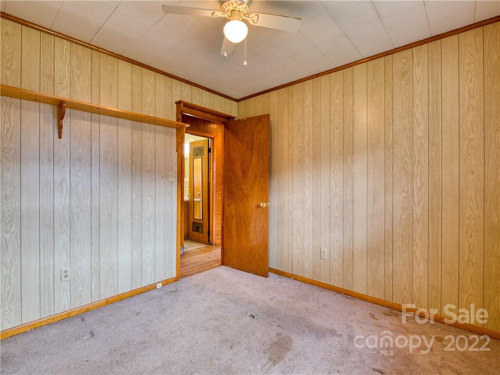 208 Balsam Ridge Road Waynesville, NC 28786 - Photo 17 of 25 a view of a room with a wooden walls