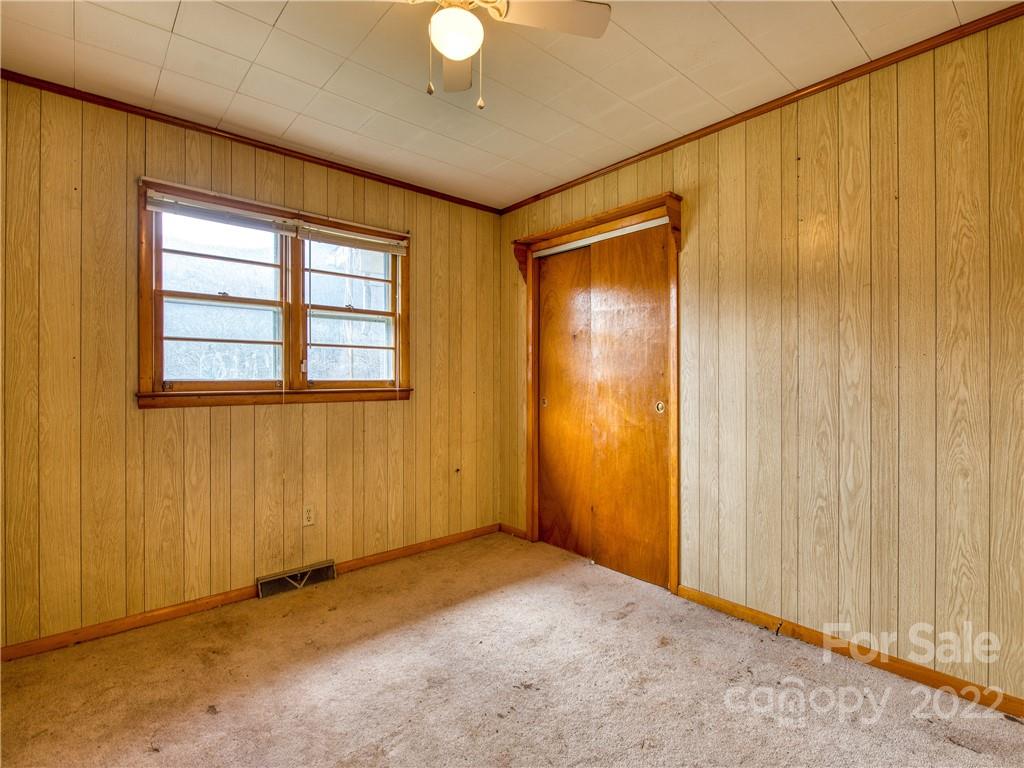 208 Balsam Ridge Road Waynesville, NC 28786 - Photo 18 of 25 an empty room with windows