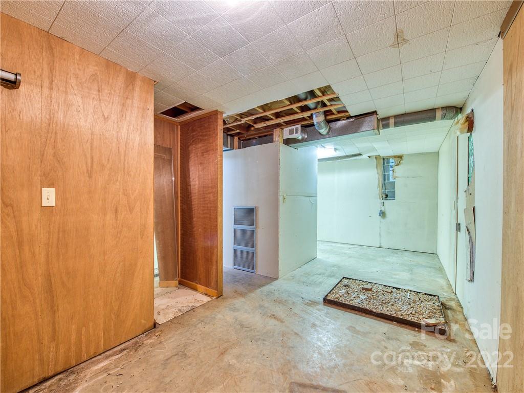 208 Balsam Ridge Road Waynesville, NC 28786 - Photo 24 of 25 a view of a bathroom with a shower and a sink