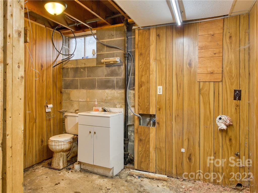 208 Balsam Ridge Road Waynesville, NC 28786 - Photo 25 of 25 a bathroom with a sink and a toilet