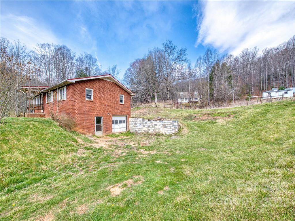 208 Balsam Ridge Road Waynesville, NC 28786 - Photo 3 of 25 a front view of house with yard and trees