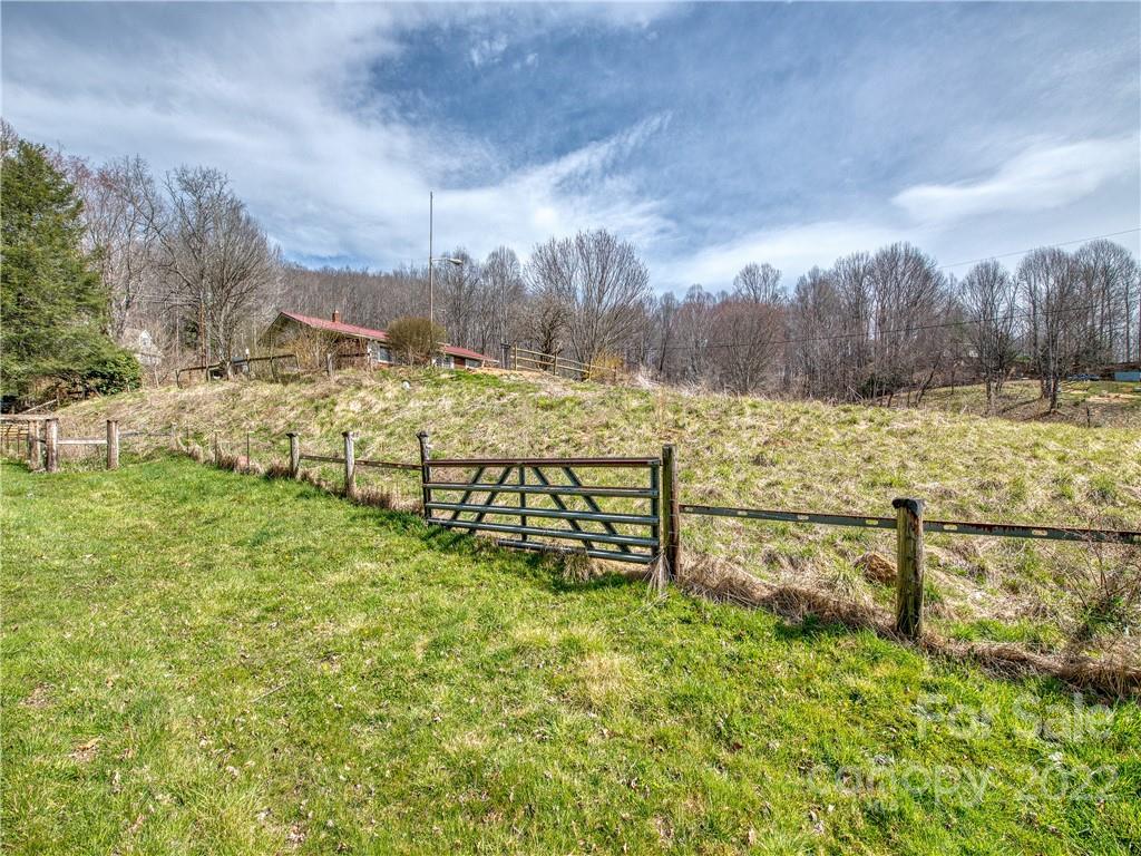 208 Balsam Ridge Road Waynesville, NC 28786 - Photo 6 of 25 a view of a garden with an outdoor space