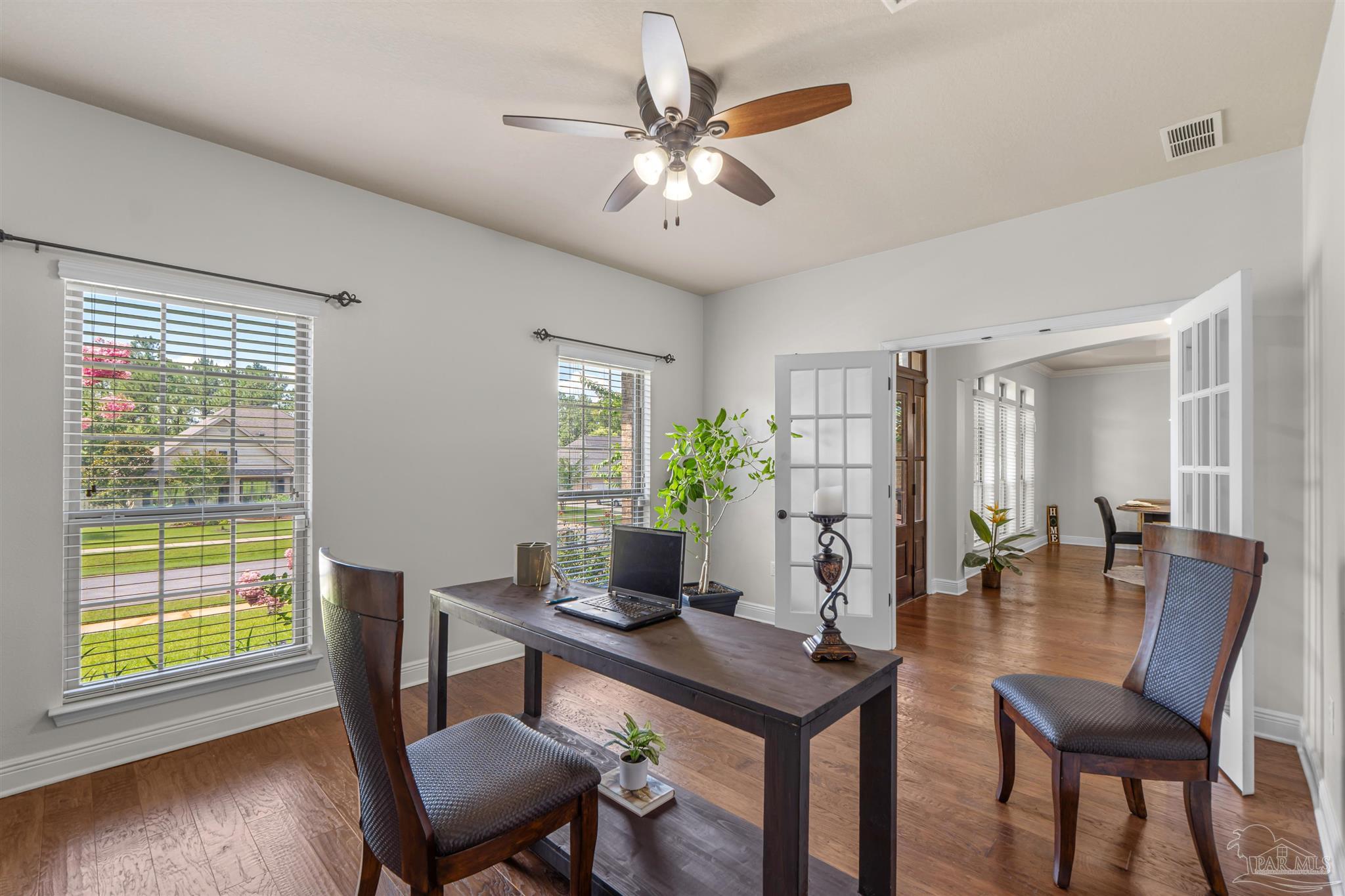 2698 Tulip Hill Road Pace, FL 32571 - Photo 14 of 65 a workspace with furniture and wooden floor