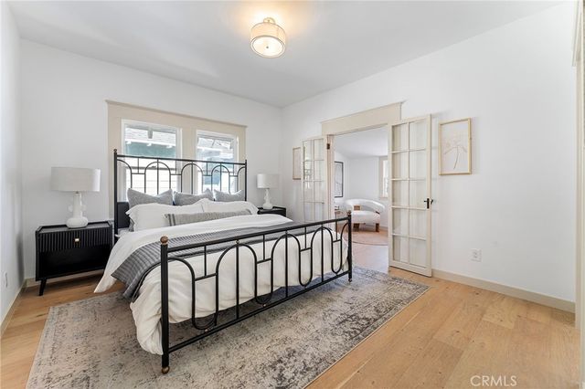 a spacious bedroom with a bed and a window