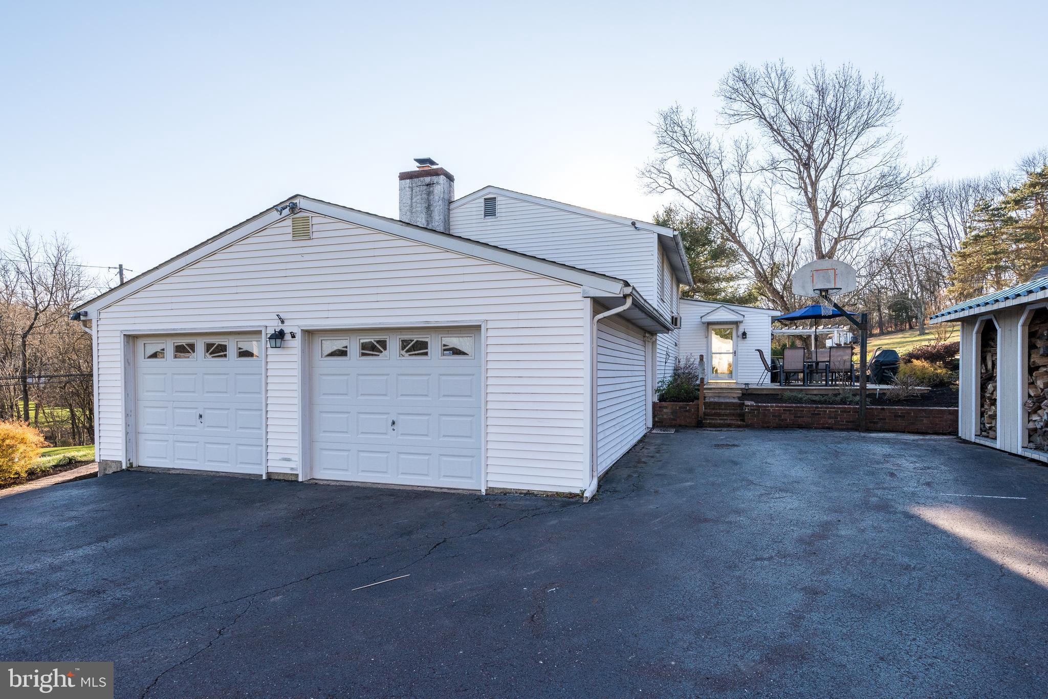 518 South Perkasie Road Perkasie, PA 18944 - Photo 65 of 66 garage with work bench and pellet stove