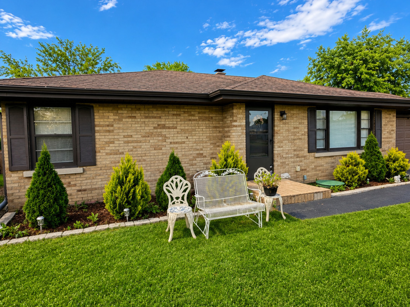 900 Westminster Road Joliet, IL 60435 - Photo 1 of 16 a front view of a house with a garden