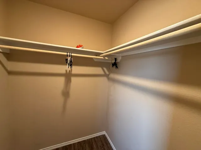 a view of a room with racks on the wall