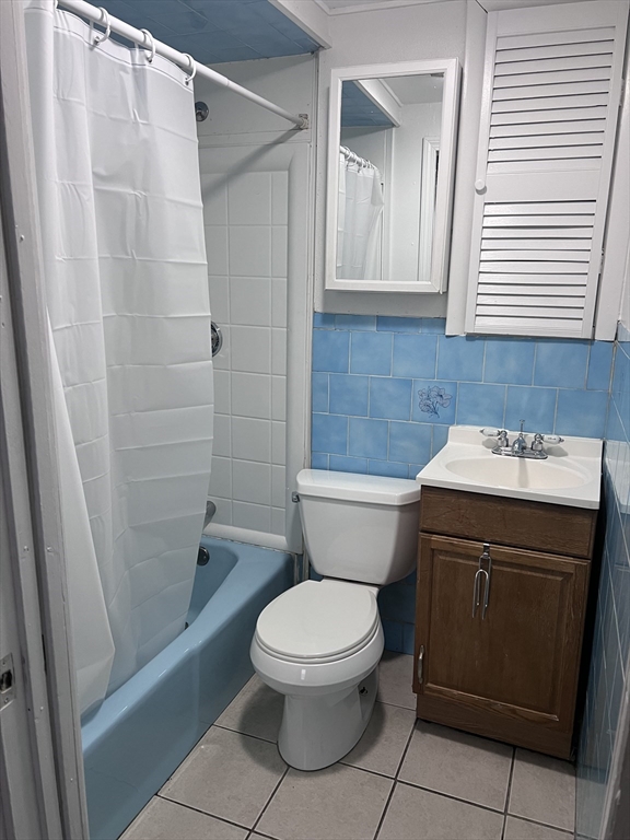 234 Clark Avenue, Unit 1 Chelsea, MA 02150 - Photo 6 of 6 a bathroom with a toilet a sink and a shower