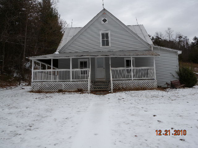 a view of house with roof deck