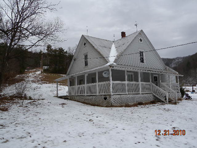 6261 Dillons Mill Road Callaway, VA 24067 - Photo 2 of 16 a wooden house with a large tree in front of a house