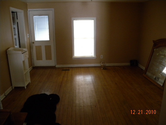 6261 Dillons Mill Road Callaway, VA 24067 - Photo 5 of 16 a view of empty room with wooden floor and fan