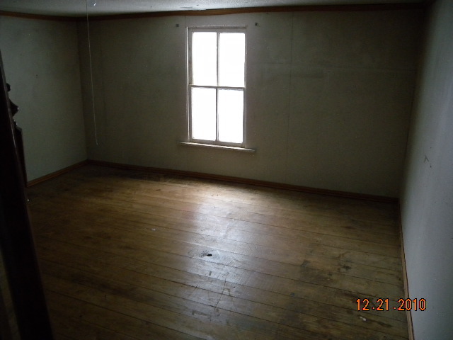 6261 Dillons Mill Road Callaway, VA 24067 - Photo 7 of 16 an empty room with wooden floor and windows