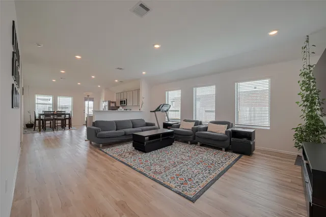 a living room with furniture or couch and a wooden floor