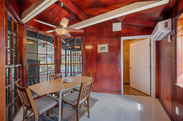 a bedroom with a bed and a ceiling fan