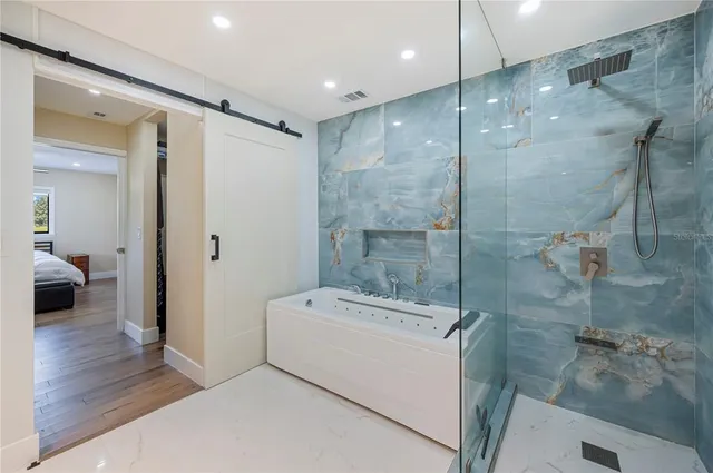 a view of a hallway with furniture and a livingroom