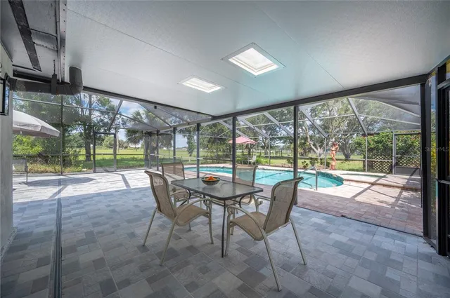 a patio with table and chairs