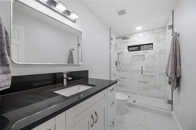 a view of entryway with stairs and wooden floor