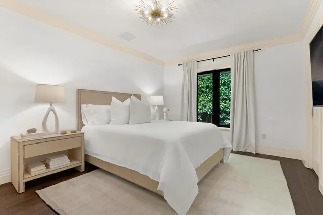 a spacious bathroom with a granite countertop sink and a large mirror