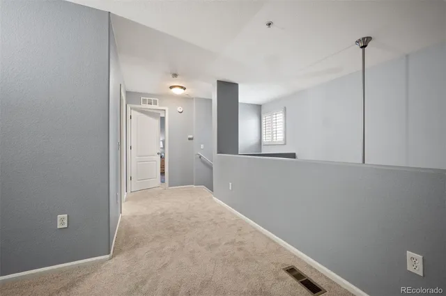 a bed room with a bed and a chair