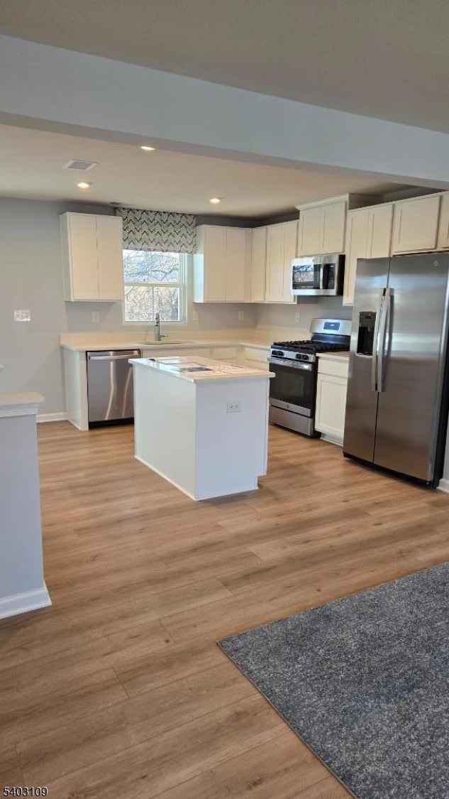 11 Limestone Boulevard Washington, NJ 07882 - Photo 2 of 18 a large kitchen with stainless steel appliances kitchen island a large counter top and a stove