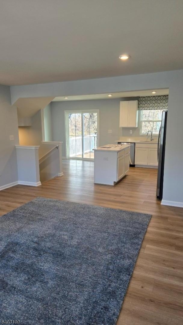 11 Limestone Boulevard Washington, NJ 07882 - Photo 8 of 18 wooden floor with a kitchen view