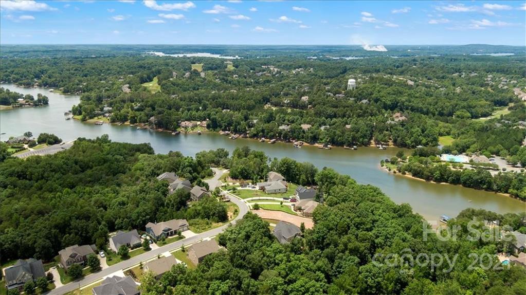 358 Calming Way Tega Cay, SC 29708 - Photo 2 of 5 an aerial view of city and lake with trees all around