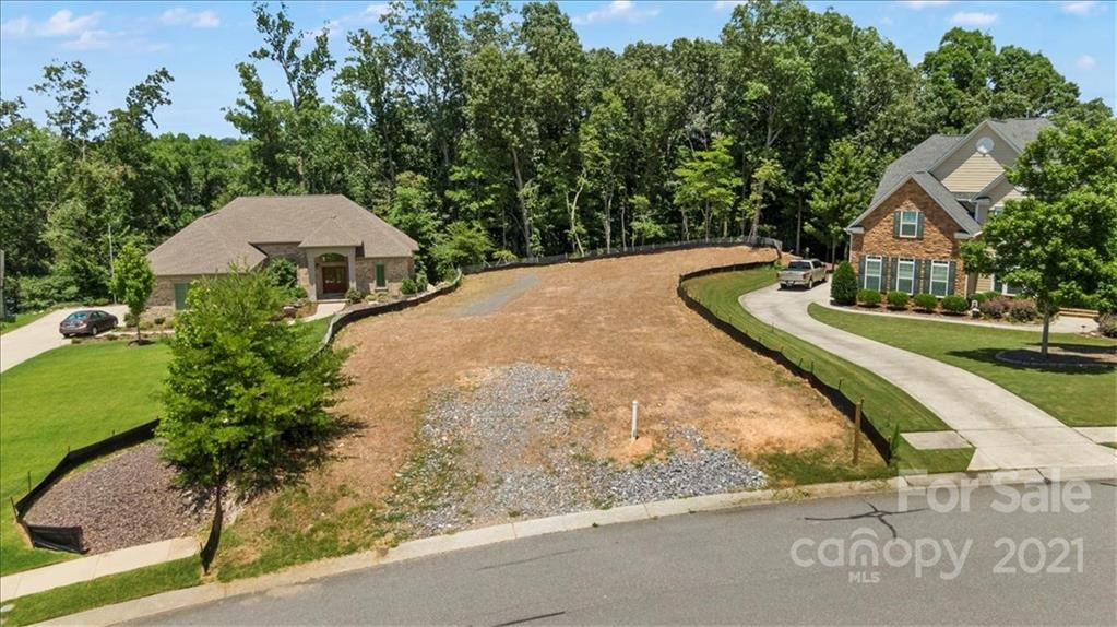 358 Calming Way Tega Cay, SC 29708 - Photo 4 of 5 a view of a house with a yard and large trees
