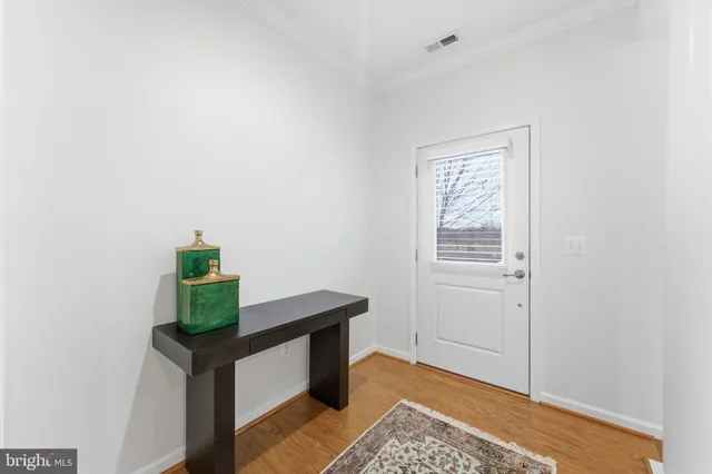 a view of an entryway with table and a window