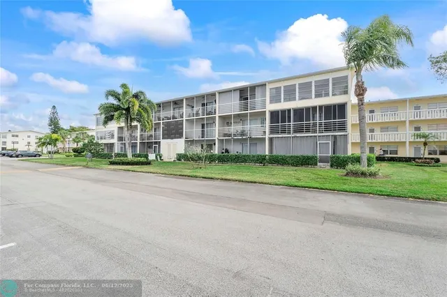 a view of a building with a yard