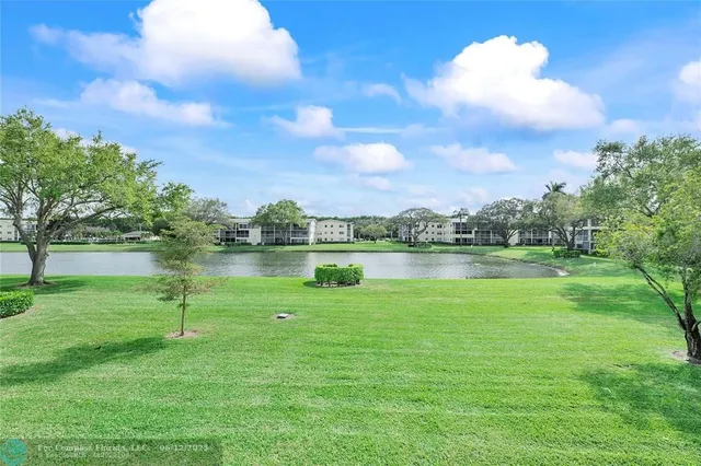 a view of a lake with a big yard