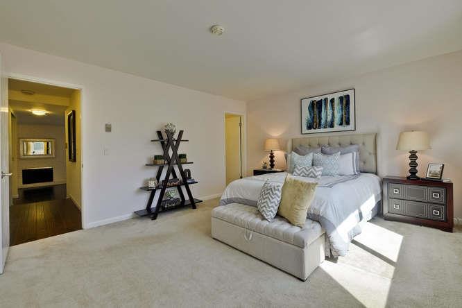 100 East Middlefield Road, Unit 2B Mountain View, CA 94043 - Photo 15 of 28 a bedroom with a bed and a view of kitchen