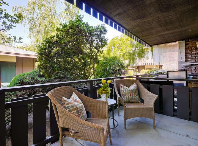 100 East Middlefield Road, Unit 2B Mountain View, CA 94043 - Photo 25 of 28 a roof deck with chairs and wooden fence