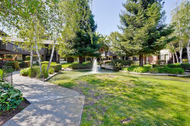 100 East Middlefield Road, Unit 2B Mountain View, CA 94043 - Photo 27 of 28 a view of a house with garden and trees