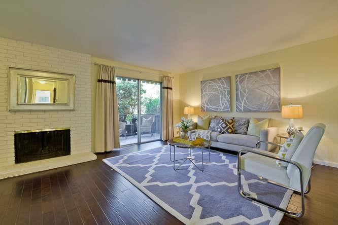 100 East Middlefield Road, Unit 2B Mountain View, CA 94043 - Photo 4 of 28 a living room with furniture and a fireplace