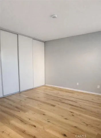 a bathroom with a granite countertop toilet a sink and a shower