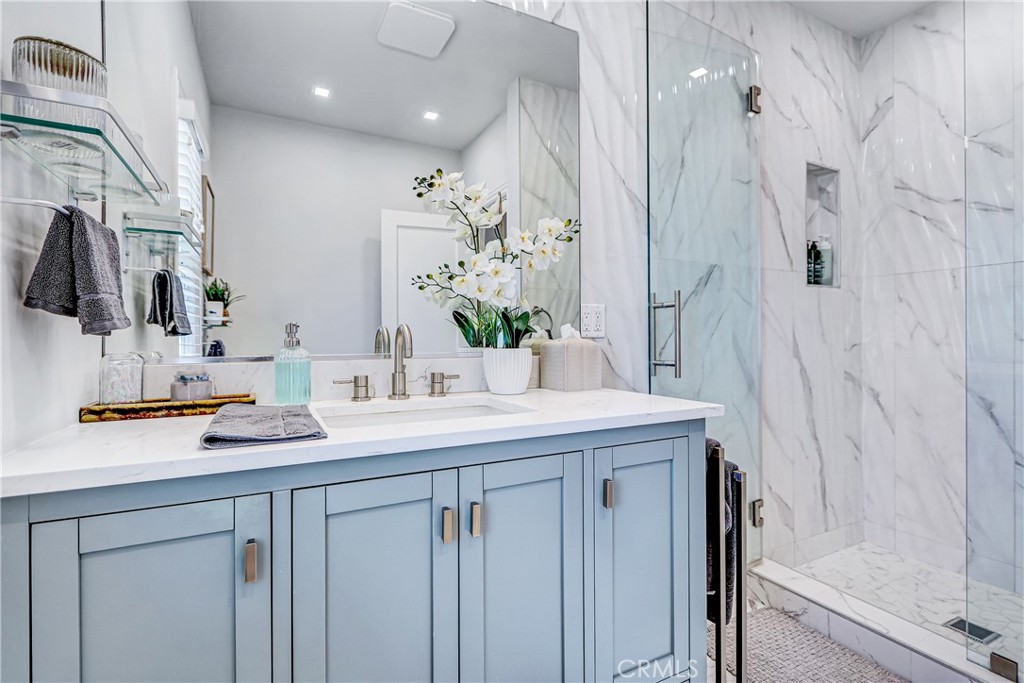230 40th Street, Unit 1 Manhattan Beach, CA 90266 - Photo 15 of 19 a bathroom with a sink and a mirror