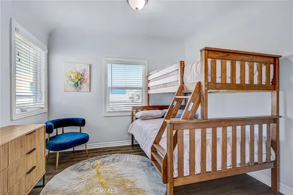a bedroom with furniture and a window